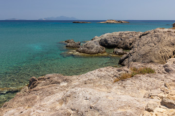 Fototapeta na wymiar beautiful rocky coast of the Greek Islands in the Mediterranean sea, small villages on the shore, great places for summer beach holidays in Corfu, KOs, Crete