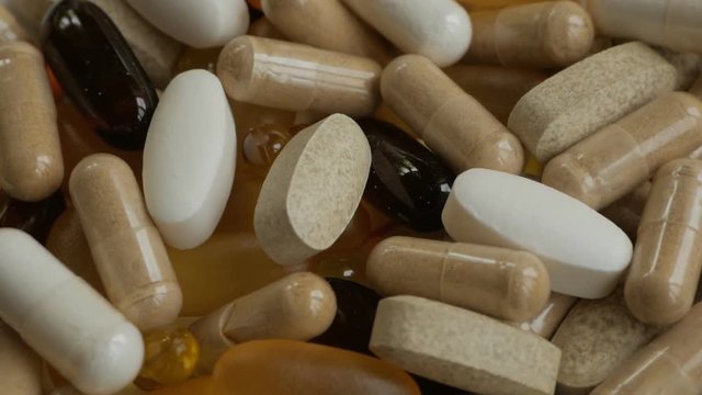 A lot of medicine capsules and pills Rotating. Biologically active additive.