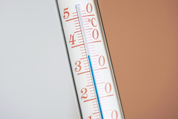 Thermometer during hot weather with solid background