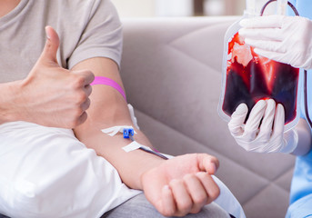 Patient getting blood transfusion in hospital clinic