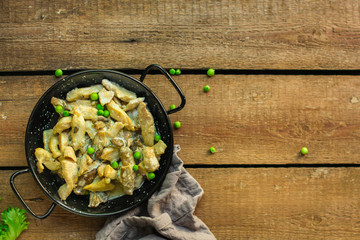chicken meat with mushrooms in a creamy sauce - snacks. healthy food and menu. copy space