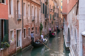 Obraz na płótnie Canvas Panoramic view of Venice narrow canal with historical buildings and gondolas