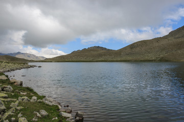 Naklejka na ściany i meble Panorama of lake scenes in mountains, national park Dombay, Caucasus