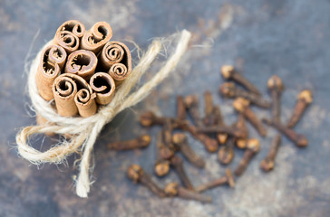Organic healthy spices, cinnamon sticks with cloves, top view