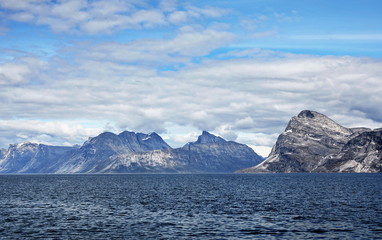 Fototapeta na wymiar Landscape Greenland, beautiful Nuuk fjord, ocean with mountains background