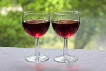 Vintage glass goblet on green background