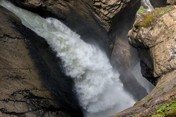 View closeup waterfall of Trmmelbach fall in mountains, valley of waterfalls