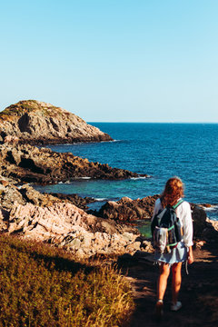 Woman hiker explores M&ouml;lle's Cliffs with Ocean Horizon
