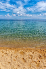 Summer beach background. Sand, sea and sky