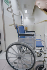Fototapeta na wymiar A wheelchair in the corridor of the hospital.