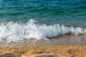 Wave of the sea on the sand beach