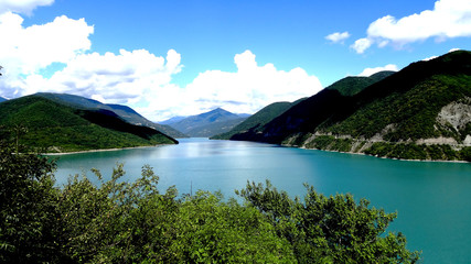Fototapeta na wymiar Beautiful view of the lake, nice color, surrounded by mountains. Background