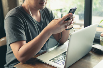Working with Laptop computer and Mobile phone device.Technology Communication gadget device.