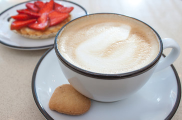 Cappuccino and strawberry tart.