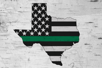American thin green line flag on map of Texas