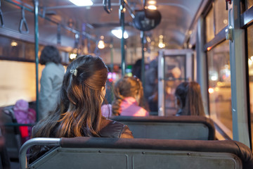 People in old public bus, view from inside the bus . People sitting on a comfortable bus in...