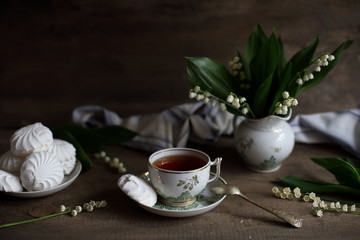 tea with marshmallows and lilies of the valley