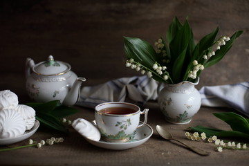 tea with marshmallows and lilies of the valley