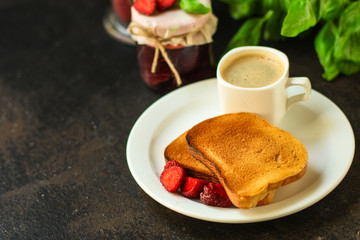 Toast, strawberry jam and coffee - breakfast (tasty snack with basil, dessert). food background. top view. copy space