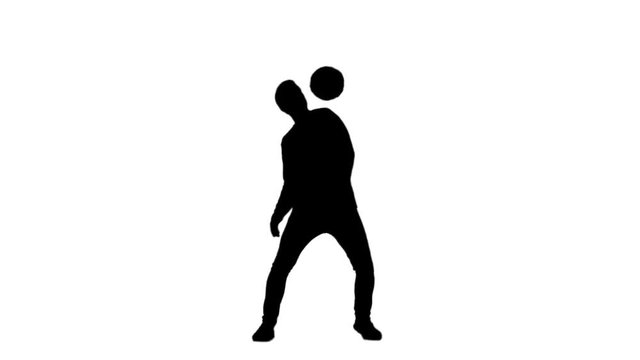 Black silhouette of guy stuffing soccer ball on his shoulder.