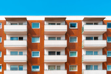 Fototapeta na wymiar Colorful apartment building facade against the sky