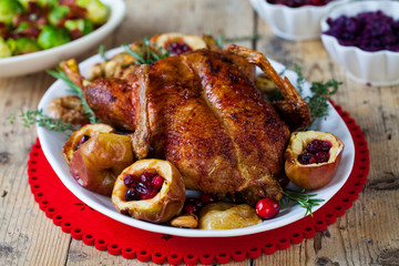 Festive roast duck with apples and cranberries