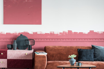Elegant living room interior with brown couch and white and red ombre wall