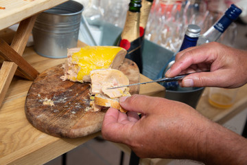 foie gras on bread in hand on festive table background © OceanProd