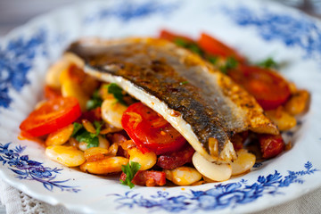 Sea bass with butter beans and tomatoes