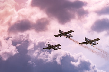 Airplanes on airshow. Aerobatic team performs flight at air show in Krakow, Poland.