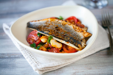 Sea bass with butter bean and tomato salad