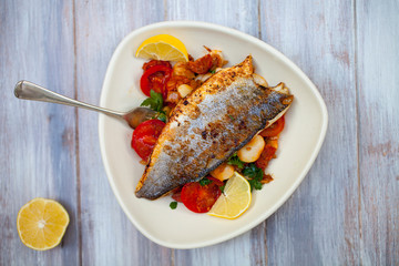 Sea bass with butter bean and tomato salad
