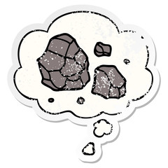 cartoon rocks and thought bubble as a distressed worn sticker