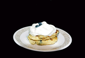 Blueberries Pancakes ,Cream on a plate