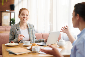 Meeting of business ladies in cafe