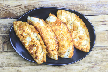 Homemade fried empanadas with tomato sauces.