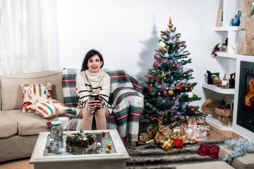 Young girl on sofa at christmas