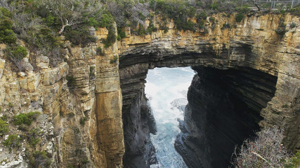 close shot of tasman arch at eaglehawk neck in tasmania