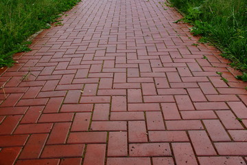 red paving slabs after rain surface abstract