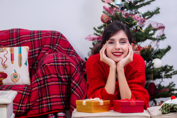 Young girl near christmas tree
