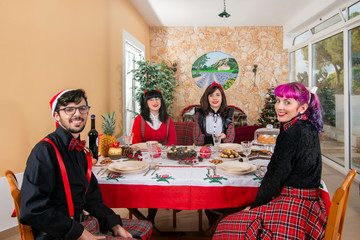 group of friends at christmas table