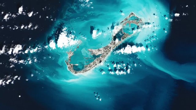 Satellite view aerial scenic ladscape of island in blue ocean, Bermuda archpelago islands. Contains public domain image by Nasa