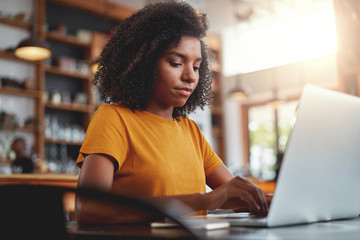 Fototapeta na wymiar Young woman working on her laptop