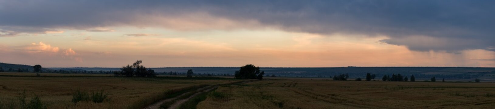 Leaden, storm clouds covered the sunset. Cumuliform cloudscape on blue sky. The terrain in southern Europe. Fantastic skies on the planet earth. Tragic gloomy sky. © Piotr