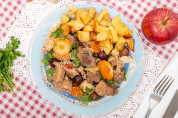 cooked meat with potatoes