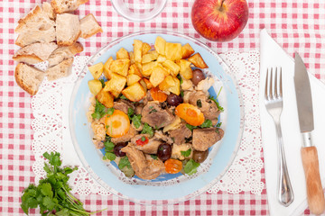cooked meat with potatoes