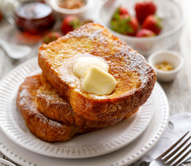 French toast, warm French toast made of sliced brioche with fresh butter, sprinkled with powdered sugar. Delicious, traditional breakfast