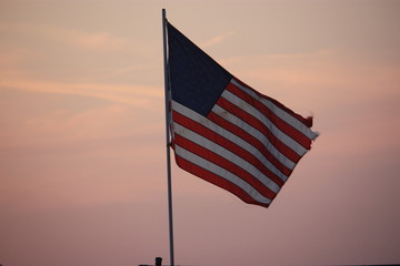american flag at sunset