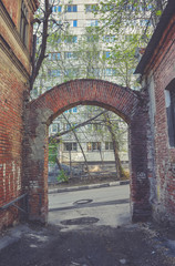 Old alley with arch from red brick