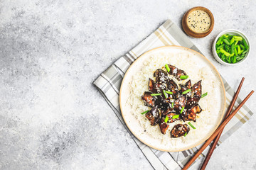 Grilled eggplant teriyaki with rice and sesame sprinkle. Japanese cuisine. Selective focus